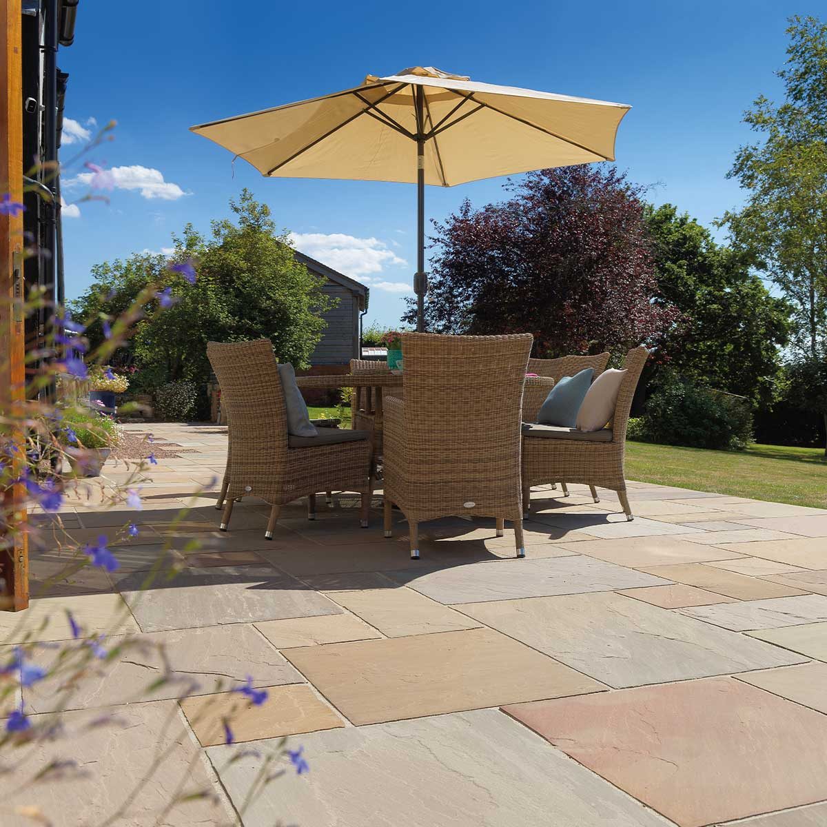 Raj blend Indian sandstone patio with garden furniture